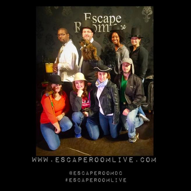 Team Disturbed Friends (Aaron, Mike, Shanell, Jess, Dalia, Chris, JoAnne and Jason) found the historian and the lost manuscript! Photo courtesy of Escape Room Live Alexandria's Facebook page.